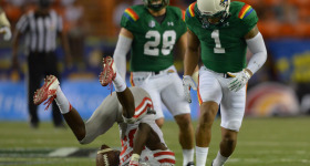 UNLV #83 Devonte Boyd holds onto a pass as UH #1 Ne'Quan Phillips looks on in third quarter drive.  ALOHA STADIUM, HONOLULU, HAWAII. photo CORY LUM/ CIVIL BEAT