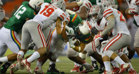 UNLV defensive attempts to stop Hawaii Rainbow Warriors in the first half of action at Aloha Stadium.  ALOHA STADIUM, HONOLULU, HAWAII. photo CORY LUM/ CIVIL BEAT