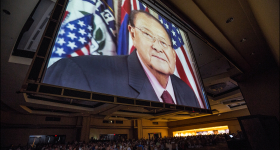 The image of the late Sen. Dan Inouye in a tribute film looms over delegates to open of the second day of the Democratic Party of Hawaii State Convention. 5.25.14©PF Bentley/Civil Beat