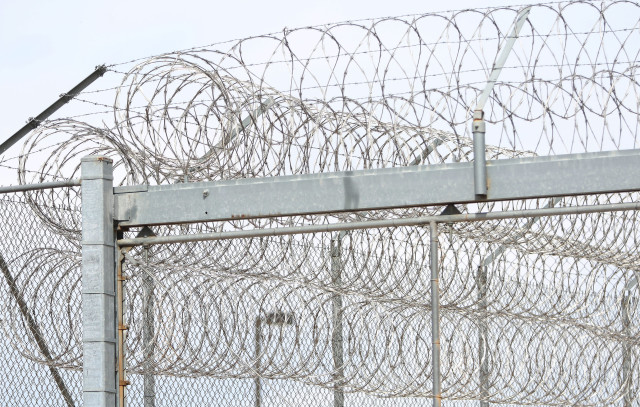 Saguaro Correctional Center CCA Fence CCA mountains Eloy Arizona Razor Wire1