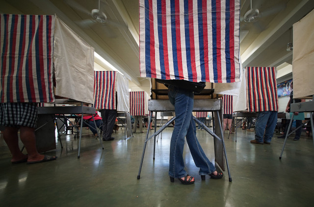 Fashionable heals bedecked voter as she casts her ballot at Kahaluu Elementary School. 8 nov 2016 9:54am.
