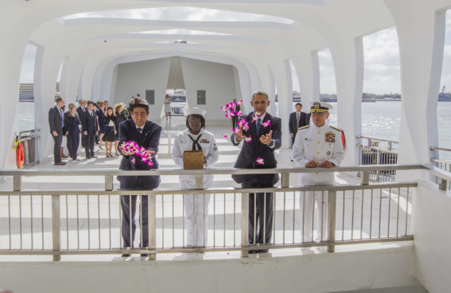 20161227-4666 CTY OBAMA ABE MEET ARIZONAPHOTO BY DENNIS ODAPresident Obama met with Japanese Prime Minister Shinzo Abe inside the Arizona Memorial to lay wreaths (at Joint Base Pearl Harbor-Hickam in Honolulu, Hawaii). After laying wreaths, they left the inner chamber and went to the "well" over the ship and threw orchids into the water. (l-r) Abe, YN2 (yeoman 2nd class) Mihelle Wrabley, Obama and Admiral Harry Harris. The meeting will be an opportunity for the two leaders to review our joint efforts over the past four years to strengthen the U.S.-Japan alliance, including our close cooperation on a number of security, economic, and global challenges. The President will also accompany Prime Minister Abe to the USS Arizona Memorial at Pearl Harbor to honor those killed. The two leadersÕ visit will showcase the power of reconciliation that has turned former adversaries into the closest of allies, united by common interests and shared values. PHOTO BY DENNIS ODA. DEC. 27, 2016. Pearl Harbor-Hickam in Honolulu, Hawaii). The meeting will be an opportunity for the two leaders to review our joint efforts over the past four years to strengthen the U.S.-Japan alliance, including our close cooperation on a number of security, economic, and global challenges. The President will also accompany Prime Minister Abe to the USS Arizona Memorial at Pearl Harbor to honor those killed. The two leadersÕ visit will showcase the power of reconciliation that has turned former adversaries into the closest of allies, united by common interests and shared values. PHOTO BY DENNIS ODA. DEC. 27, 2016.
