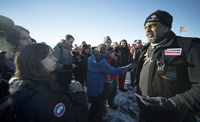 Right, Hawaii activist Andre Perez speaks to Congresswoman Tulsi Gabbard, right after disagreeing with Gabbard about the ‘Mauna Kea’ issue being quote, “resolved.” Perez disagreed and shared that there is currently a contested case hearings happening now. 4 dec 2016