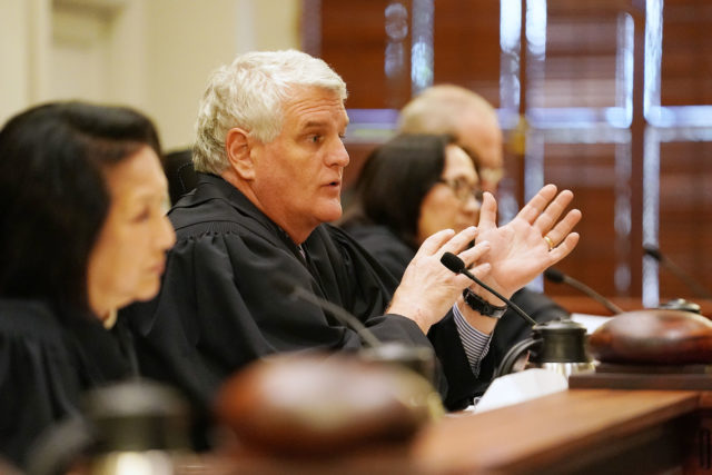 Chief Justice Mark Recktenwald gestures while questioning City attorney Duane Pang in Civil Beat case. 1 june 2017