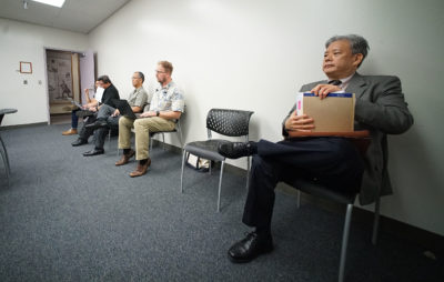 Embattled ex HPD Police Chief attorney Kevin Sumida sits in HPD Police Commission meeting.