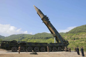 FILE - In this July 4, 2017, file photo distributed by the North Korean government, North Korean leader Kim Jong Un, second from right, inspects the preparation of the launch of a Hwasong-14 intercontinental ballistic missile (ICBM) in North Korea's northwest. Hawaii is the first state to prepare the public for the possibility of a ballistic missile threat from North Korea. The state's Emergency Management Agency on Friday, July 21, 2017 announced a public education campaign. Agency Administrator Vern Miyagi says because it would take a missile about 15 minutes to arrive, there won't be much time to prepare. He says that's why instructions are simple: "Get inside, stay inside and stay tuned."  (Korean Central News Agency/Korea News Service via AP, File)