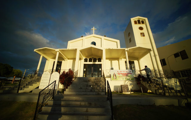 Roland Sandia walks up the entrance at Mount Carmel Church where Sandia alledges Father Apuron sexually assaulted him in Apuron’s living area located in a building at the rear of this church.