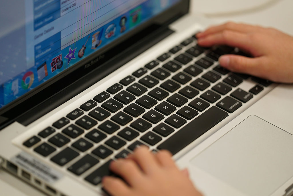 4th graders in Momilani Elementary Tech Lab class work on their laptops on their next project.