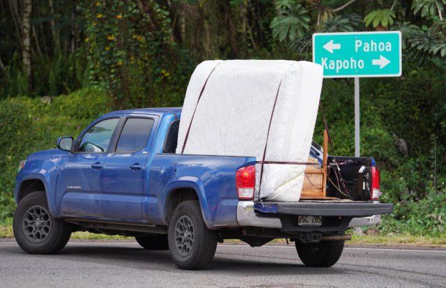 Leilani Estates residents evacuate their belongings as lava inundates their community.