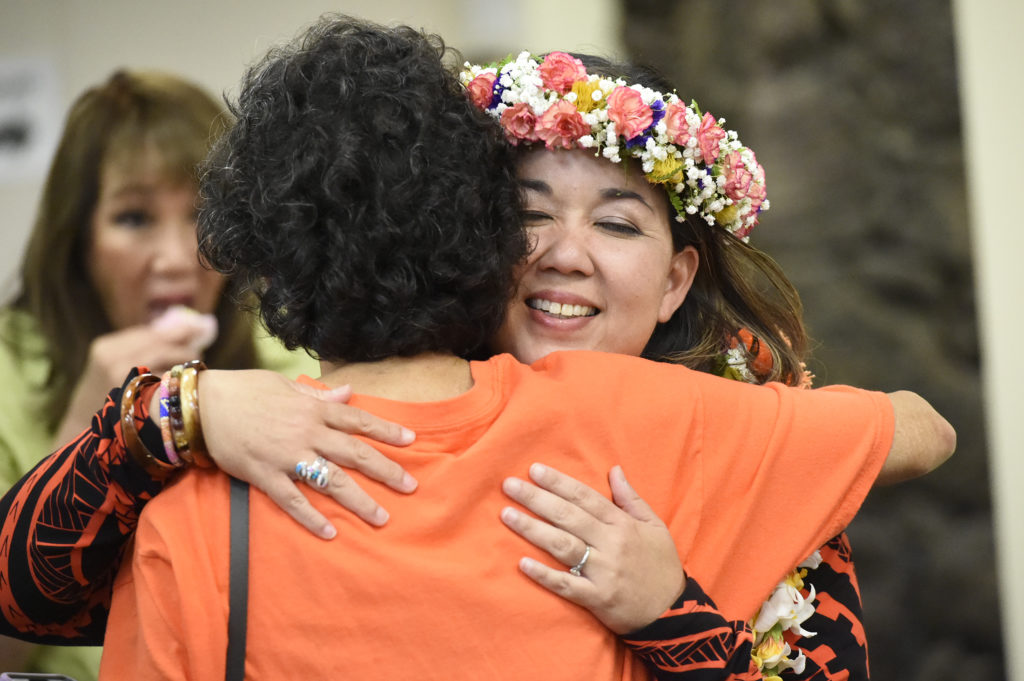 Jill Tokuda getting hug from supporters at headquarters Saturday night, August 11, 2018. (Civilbeat photo by Ronen Zilberman)