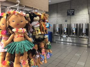 Photo showing hula dolls for sale at the Honolulu International Airport.