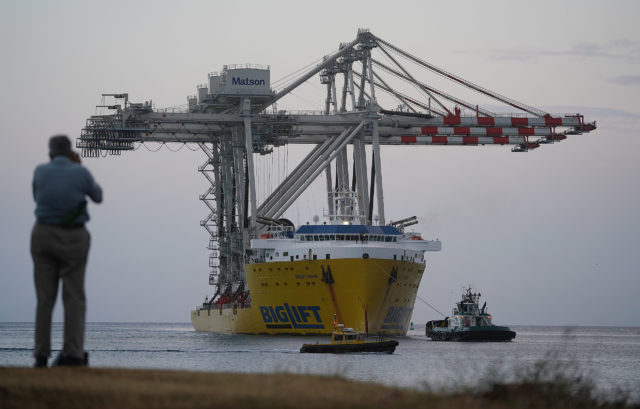 New Matson container cranes arrive at Honolulu Harbor on BigLift ship.