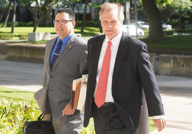 Derek Hahn arrives at District Court with Attorney Birney Bervar.