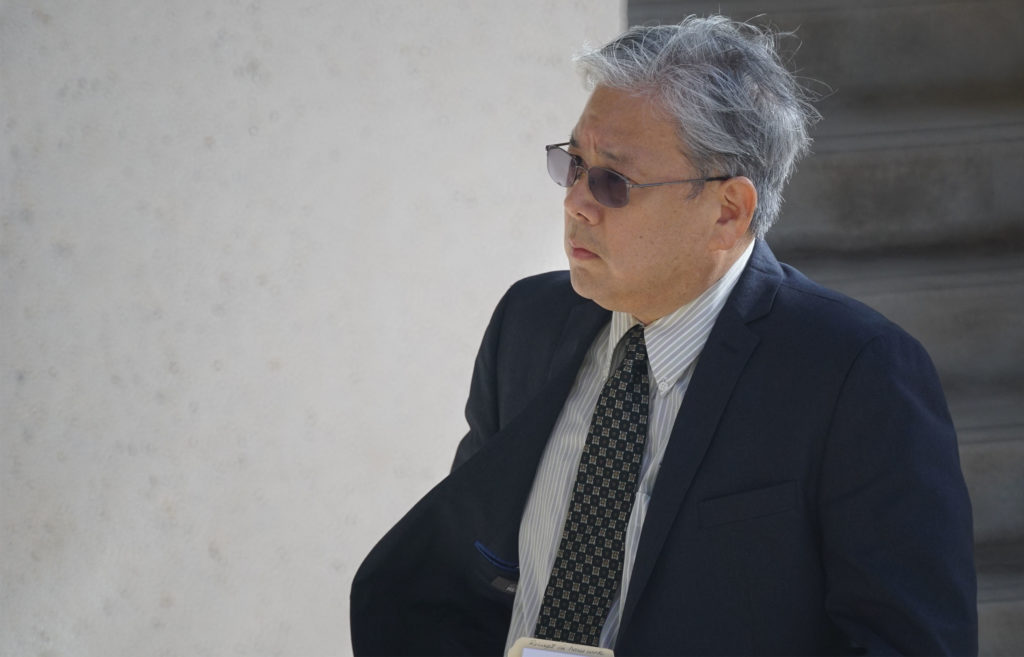 Attorney Kevin Sumida arrives at District Court.