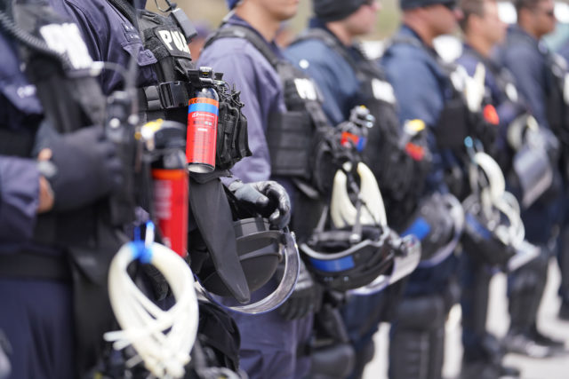 HPD Officers at Mauna Kea Access Road with oil based pepper spray /OC Spray Oleoresin Capsicum.