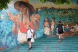 UH Campus Center mural as masked students walk thru campus during COVID-19 pandemic. October 21, 2020