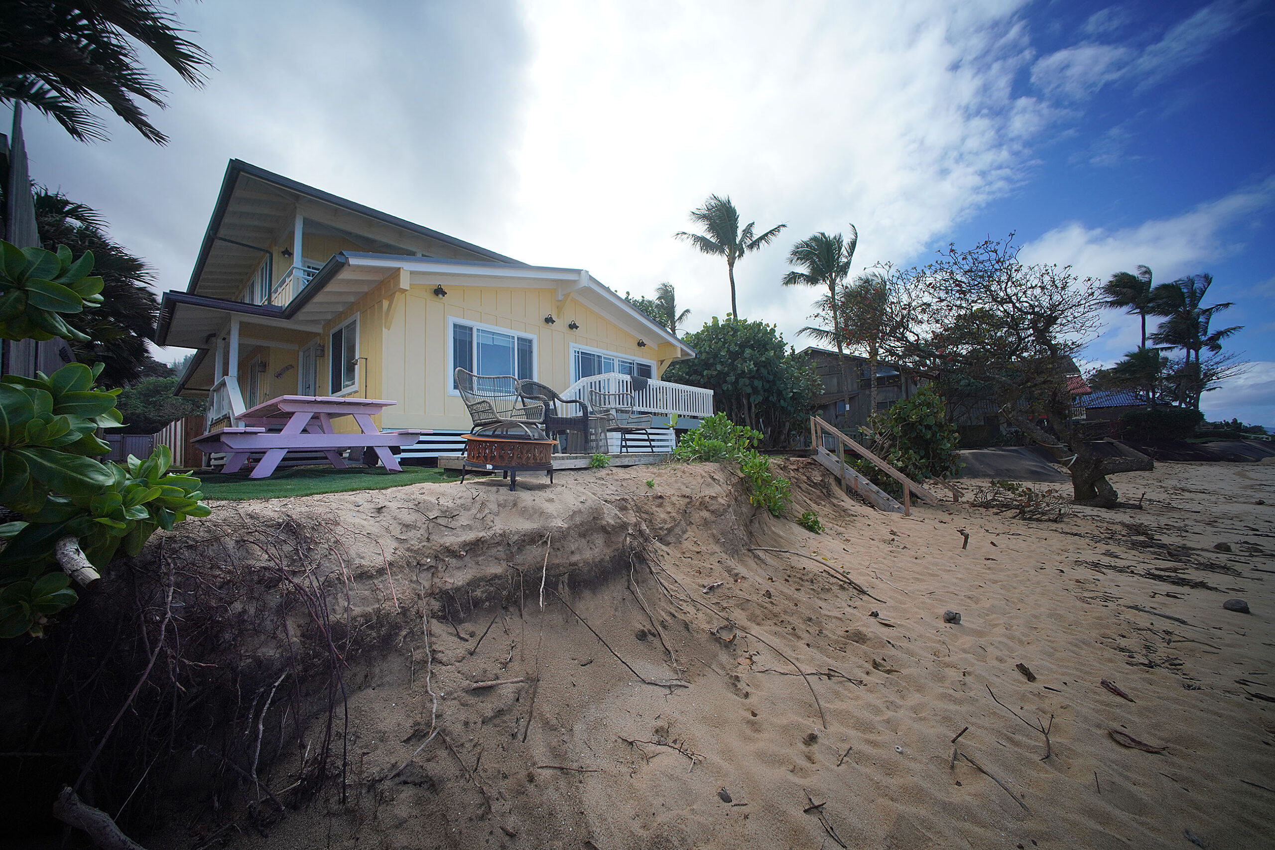 stock Sunset Beach erosion Ke Nui Road ocean sea level rise climate