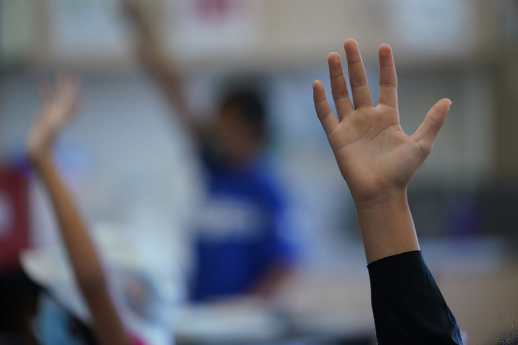 Pauoa Elementary School 3rd grade Teacher Kristin Tatemichi  teaches her class. A student raises their hand to be called on for an answer.