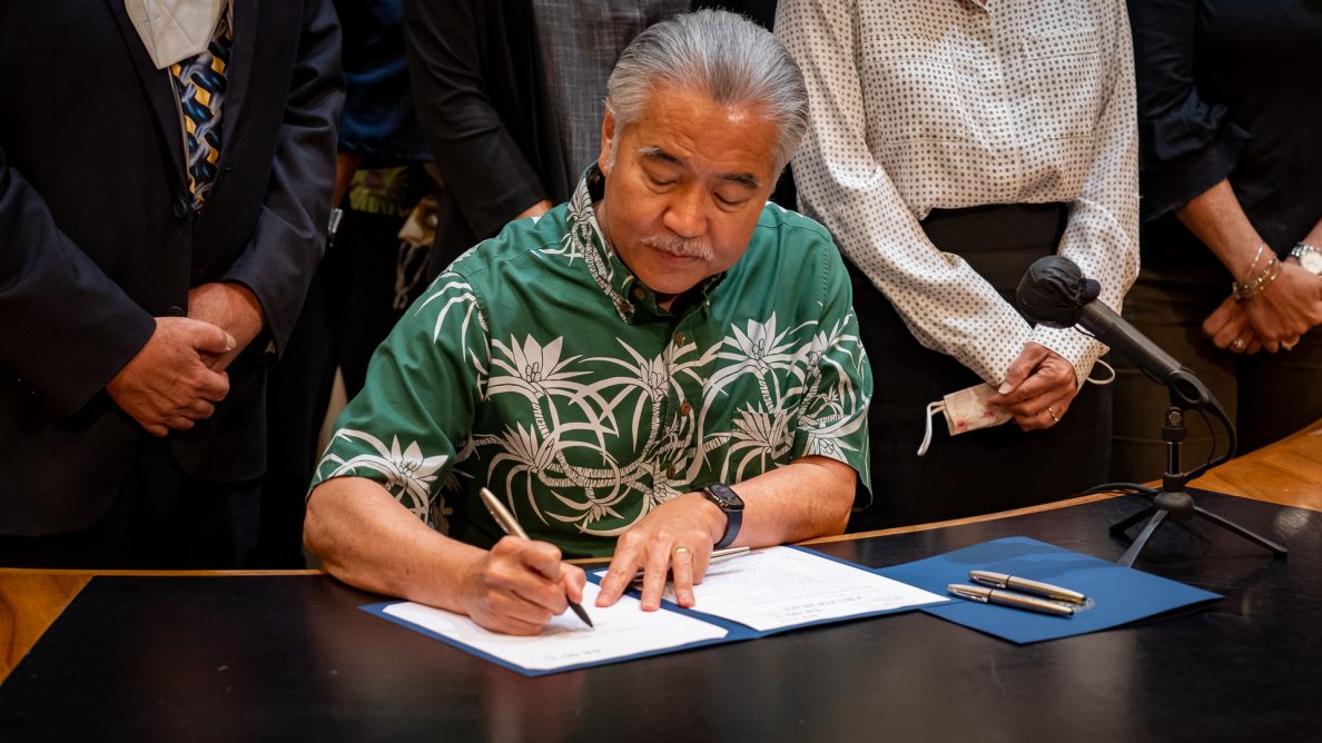 Gov. David Ige signed the minimum wage increase, the tax refund and the EITC bills into law at the Hawaii State Capitol's ceremonial room on Wednesday.