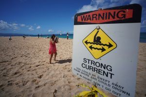 Warning sign along the beach near Pipeline.