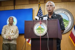 Maui Mayor Richard Bissen listens to Darryl Oliveira interim Maui Emergency Management Agency Administrator during a press conference Friday, Aug. 25, 2023, in Wailuku. The new interim Maui Emergency Management Agency Administrator Darryl Oliveira was announced. (Kevin Fujii/Civil Beat/2023)