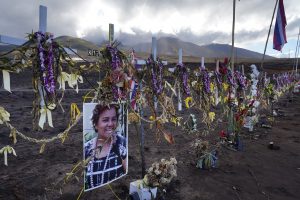 A memorial to Donna Gomes anchors the line of other fire victims Tuesday, Sept. 26, 2023, in Lahaina. Ninety-seven deaths have been confirmed. Twenty-two remain on the current missing list. (Kevin Fujii/Civil Beat/2023)