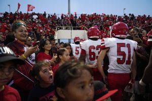 Lahainaluna High School fans celebrate the junior varsity team’s win after their first football game Saturday, Sept. 30, 2023, at War Memorial Stadium in Wailuku. The sold-out game paves the little way slowly back to normalcy after the devastating Aug. 8 fire. (Kevin Fujii/Civil Beat/2023)