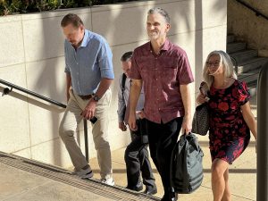 Larry Ellison, from left, and Paul Marinelli, former director of Island Air, enter the Prince Kuhio Federal Building Wednesday, Oct. 4, 2023, in Honolulu. Ellison is testifying in federal court in the Island Air bankruptcy case. (Kevin Fujii/Civil Beat/2023)
