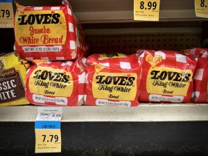 Loaves of Loves King White Bread with a regular price of $9.59 each is photographed Tuesday, Oct. 10, 2023, at Napili Market in Lahaina. The store is offering a loaf for $7.79 as a special buy. A Civil Beat reader suggested the grocer north of the razed, historic Lahaina town was price gouging. (Kevin Fujii/Civil Beat/2023)
