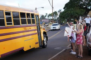 Lahainaluna supporters welcome students back to their campus Monday, Oct. 16, 2023, in Lahaina. The school has been closed since the Aug. 8 fire and studying at other schools in Maui. (Kevin Fujii/Civil Beat/2023)