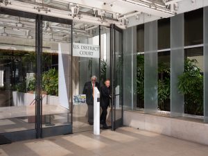 Milton Choy and Michael Jay Green walking out of the U.S. District Courthouse.