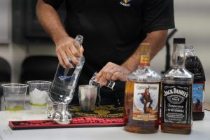 A Honolulu Police officer mixes a drink during thee media workshop on Operating a Vehicle Under the Influence of an Intoxicant also known as OVUII or DUI on Saturday, Nov. 18, 2023, at the HPD training facility in Waipahu. HPD’s message comes as the winter holidays approach. (Kevin Fujii/Civil Beat/2023)