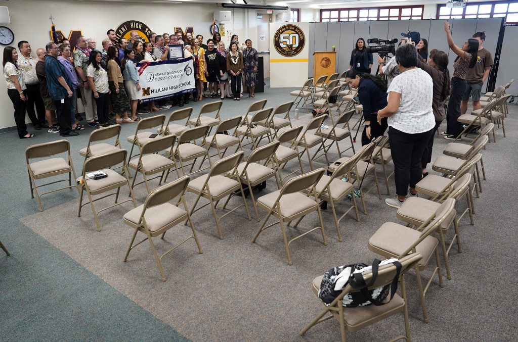 Almost all the seats for the presentation of Mililani High School Hawaiʻi Schools of Democracy award empty to be in a group photo Friday, Jan. 5, 2024, in Mililani. Along with Mililani, Maui High School was also recognized. It honors schools which teach students to be informed on current events, history and engage in the civic and democratic process. (Kevin Fujii/Civil Beat/2024)