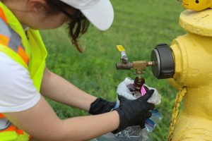 JOINT BASE PEARL HARBOR-HICKAM- Hannah Brumby, a Navy contractor, collects a water sample as part of the Navy’s Drinking Water Long-Term Monitoring program at Joint Base Pearl Harbor-Hickam, Hawaii, Jan. 31, 2024. The ongoing monitoring efforts are part of the Navy Closure Task Force-Red Hill’s (NCTF-RH) enduring, long-term commitment to ensure the safety of the environment and public health. Charged with the safe closure of the Red Hill Bulk Fuel Storage Facility (RHBFSF), NCTF-RH was established by the Department of the Navy as a commitment to the community and the environment. The task force is forming and expects to take on responsibilities for Red Hill from Joint Task Force-Red Hill in early Spring 2024. NCTF-RH continues to engage in conversations in formal and informal forums with the people of Hawaii, regulatory agencies, and experts and officials to keep stakeholders informed as the Navy works to safely and deliberately close the RHBFSF. (U.S. Navy photo by Mass Communications Specialist Seaman Krystal Diaz)