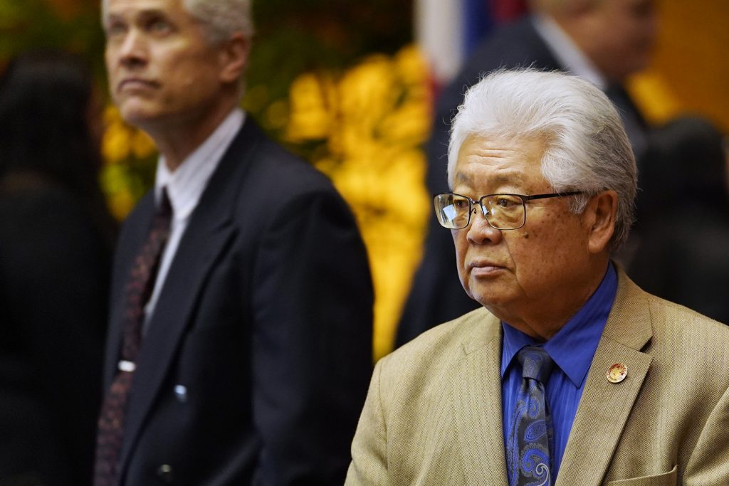 Rep. Richard Onishi walks the House of Representatives floor before passing the state budget HB1800 HD1 Wednesday, March 13, 2024, in Honolulu. The House of Representatives voted to pass its third reading to cross over to the senate. (Kevin Fujii/Civil Beat/2024)