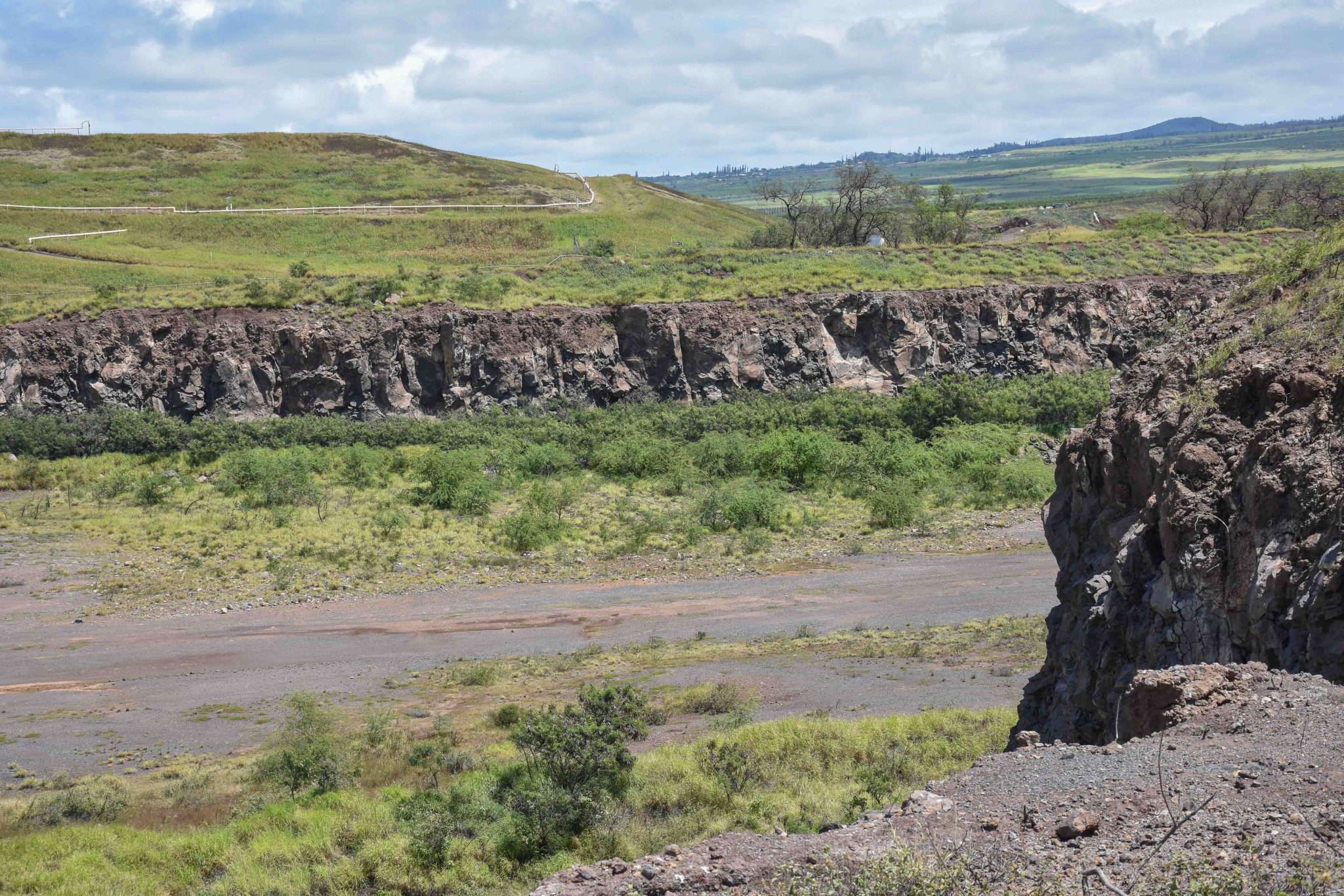 Maui County is considering trying to acquire this 20-acre parcel of quarried land next to the Central Maui Landfill by eminent domain for use as the final dump site of debris and ash from the Lahaina wildfire. (Cammy Clark/Civil Beat/2024)