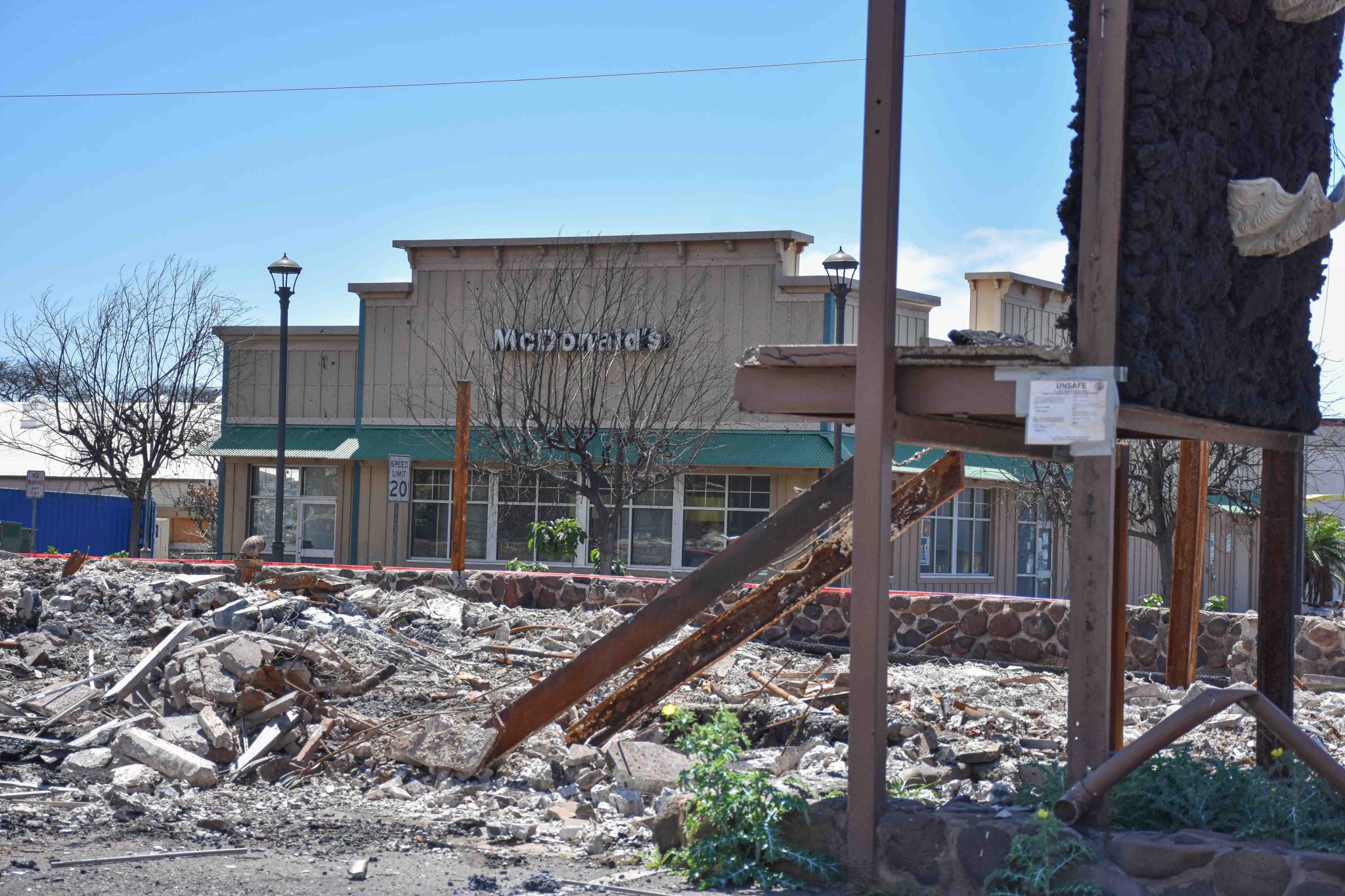 The McDonald's in Lahaina survived the Maui wildfire, but at least 140 commercial properties and public buildings did not and can be part of the Army Corps of Engineers-led debris removal program. (Cammy Clark/Civil Beat/2024)
