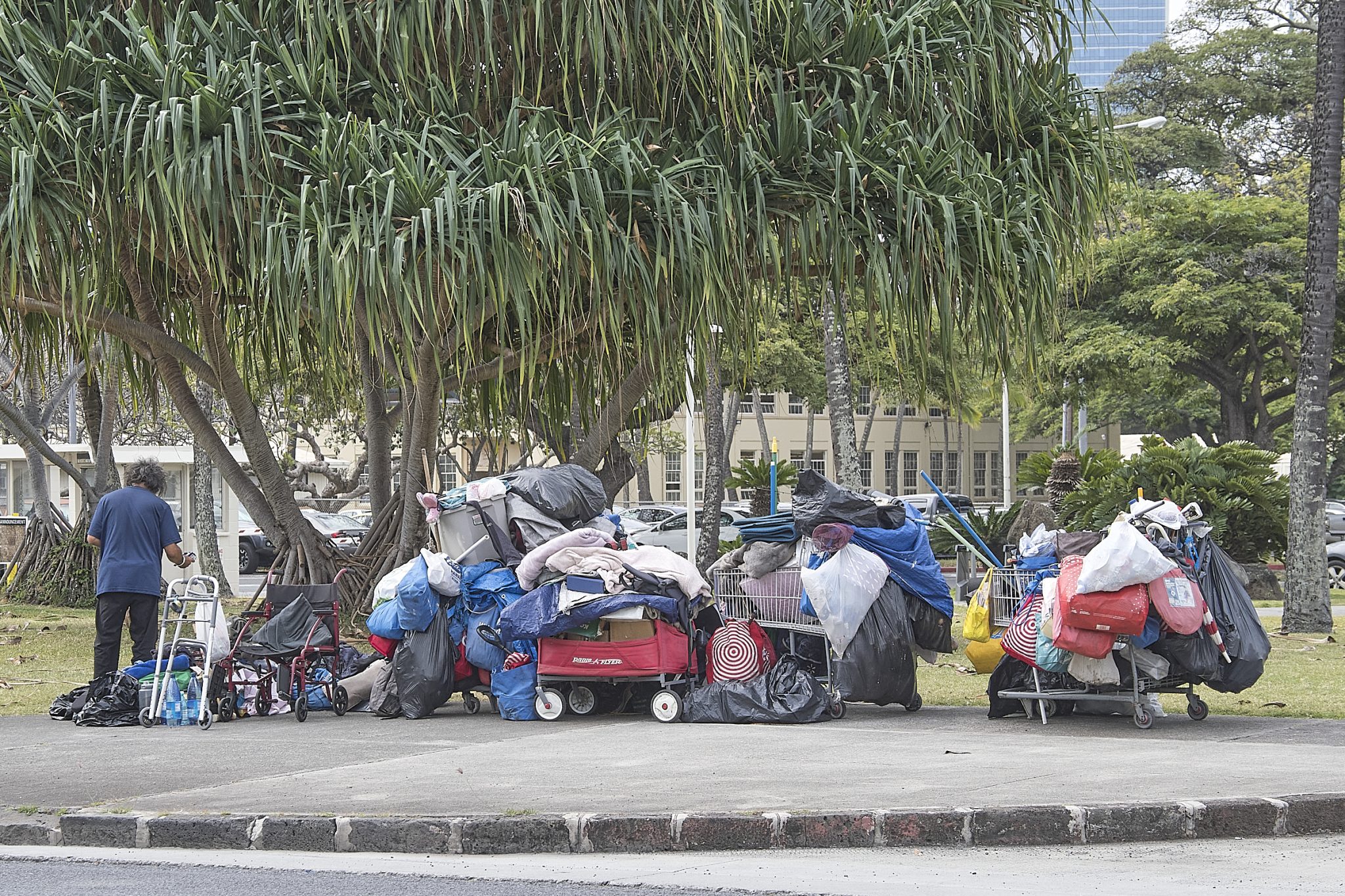 Homeless camps abound along King Street in Honolulu with many exceeding the typical small tent or cardboard box  designed to shelter for the elements. Photographed March 25th, 2024
