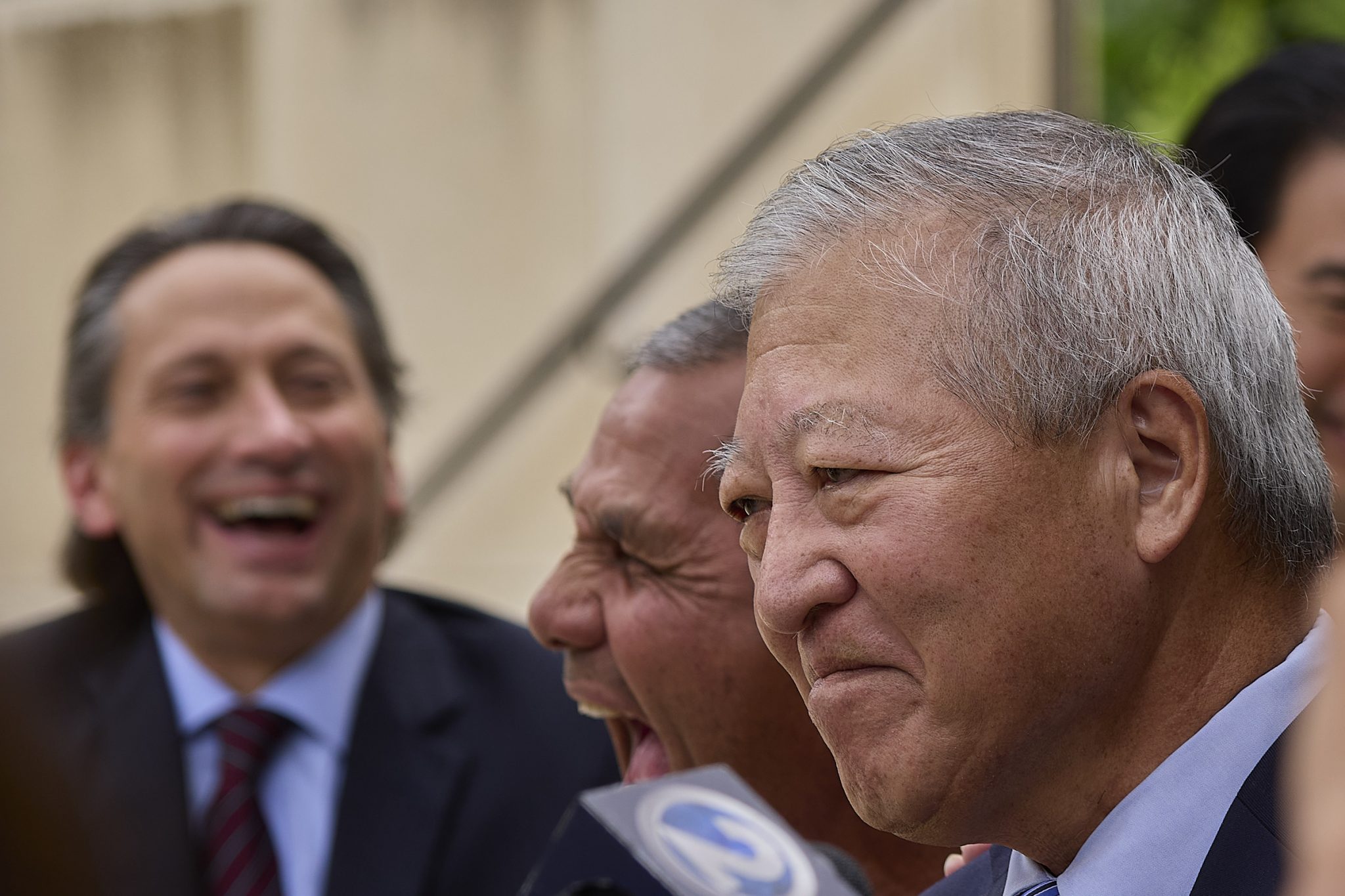 Following the Not Guilty verdict in the Kaneshiro/Mitsunaga et al bribery trial most of the defendants appeared outside the courthouse to speak with local press. (David Croxford/Civil Beat/2024)