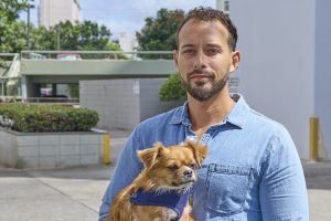 Tyler Markman stands outside of his apartment complex on Date Street where he was photographed May 21st, 2024 (David Croxford/Civil Beat/2024)