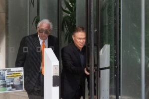 Milton Choy and Michael Jay Green walking out of the U.S. District Courthouse.