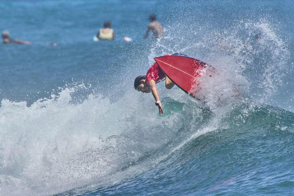 On Tuesday and Wednesday Nike Swim hosted the inaugural Honua Finals: The World Cup of Interscholastic Surfing that brought High School surfers from Hawaii, the Mainland and New Zealand together at Ala Moana Bowls to compete in the first Scholastic International surfing competition. (David Croxford/Civil Beat/2024)