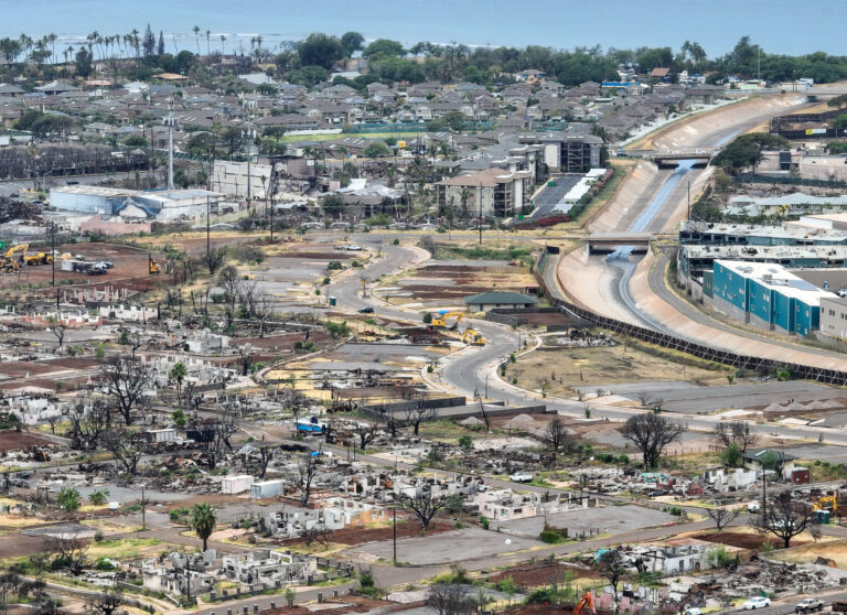 Komo Mai Street wends through Lahaina near the Kahoma Stream channel where hundreds of residential properties have been cleared since the Aug. 8, 2023, fires. This photo was taken in April. (Nathan Eagle/Civil Beat/2024)
