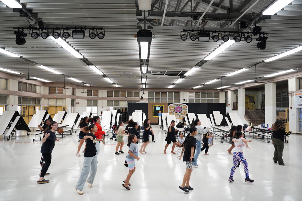 NPAC students rehearse in the Nanakuli High and Intermediate School Multi-Purpose Cafe Thursday, Aug. 212, 2024, in Waianae. (Kevin Fujii/Civil Beat/2024)