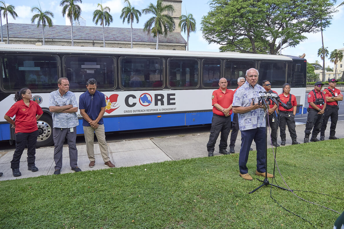 Mayor Rick Blangiardi, Anton Krucky along with several city officials and members of the City & County C.O.R.E. team gathered at Honolulu Hale to inaugurate a bus into the C.O.R.E. fleet of vehicles aimed at transporting homeless individuals to semi permanent and permanent care facilities around the island and also responding to major disasters as they ocurr. As one official said, “We aim to get people off the streets and into clean sheets”. The bus can move up to 12 people in beds and another 17 seated to facilities readied to receive candidates. (David Croxford/Civil Beat/2024)