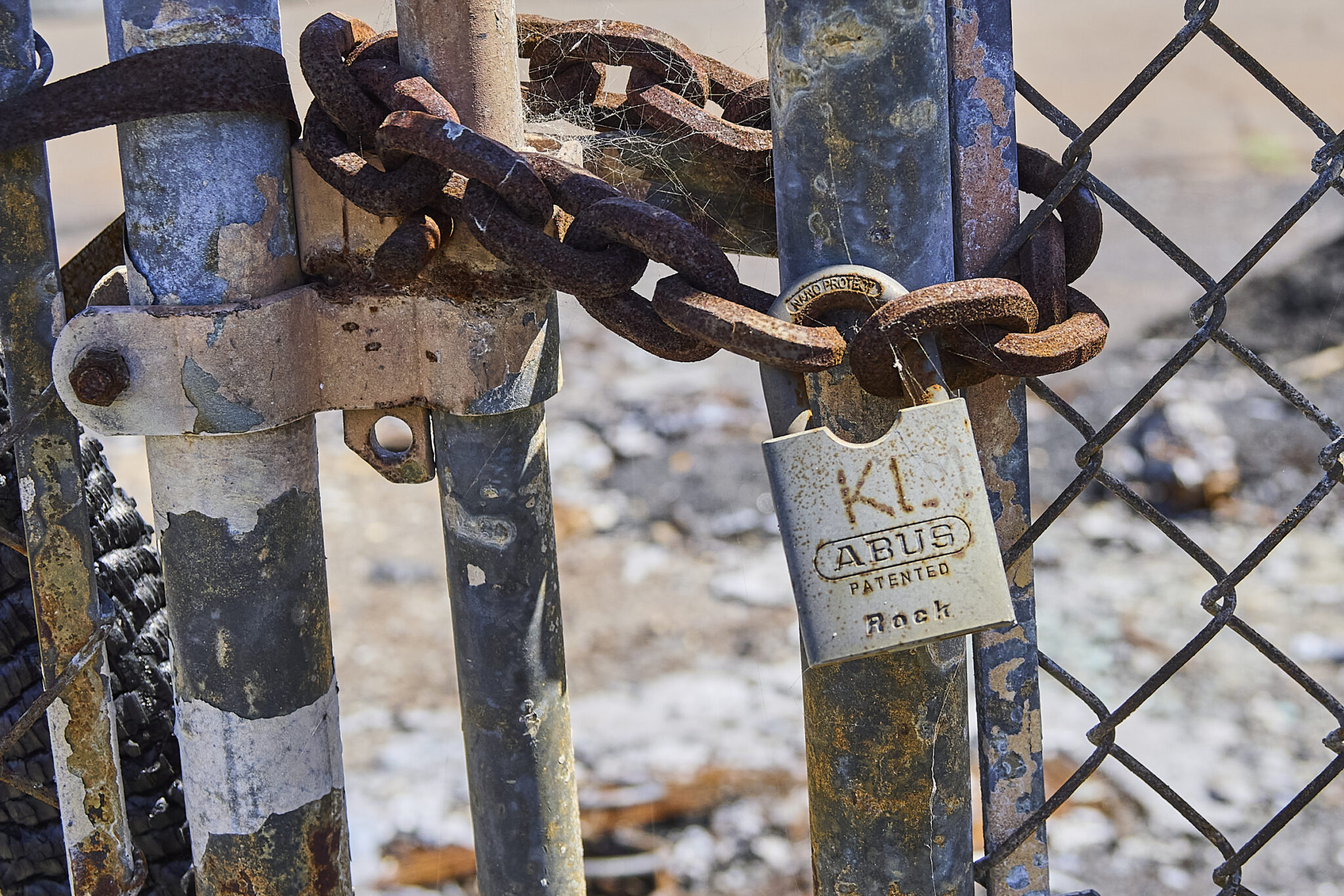Locked gates observed and photographed during a visit with Kirk Boes in the vicinity of his home that burned in Lahaina, Maui, during the August 8th 2023, inferno. (David Croxford/Civil Beat/2024