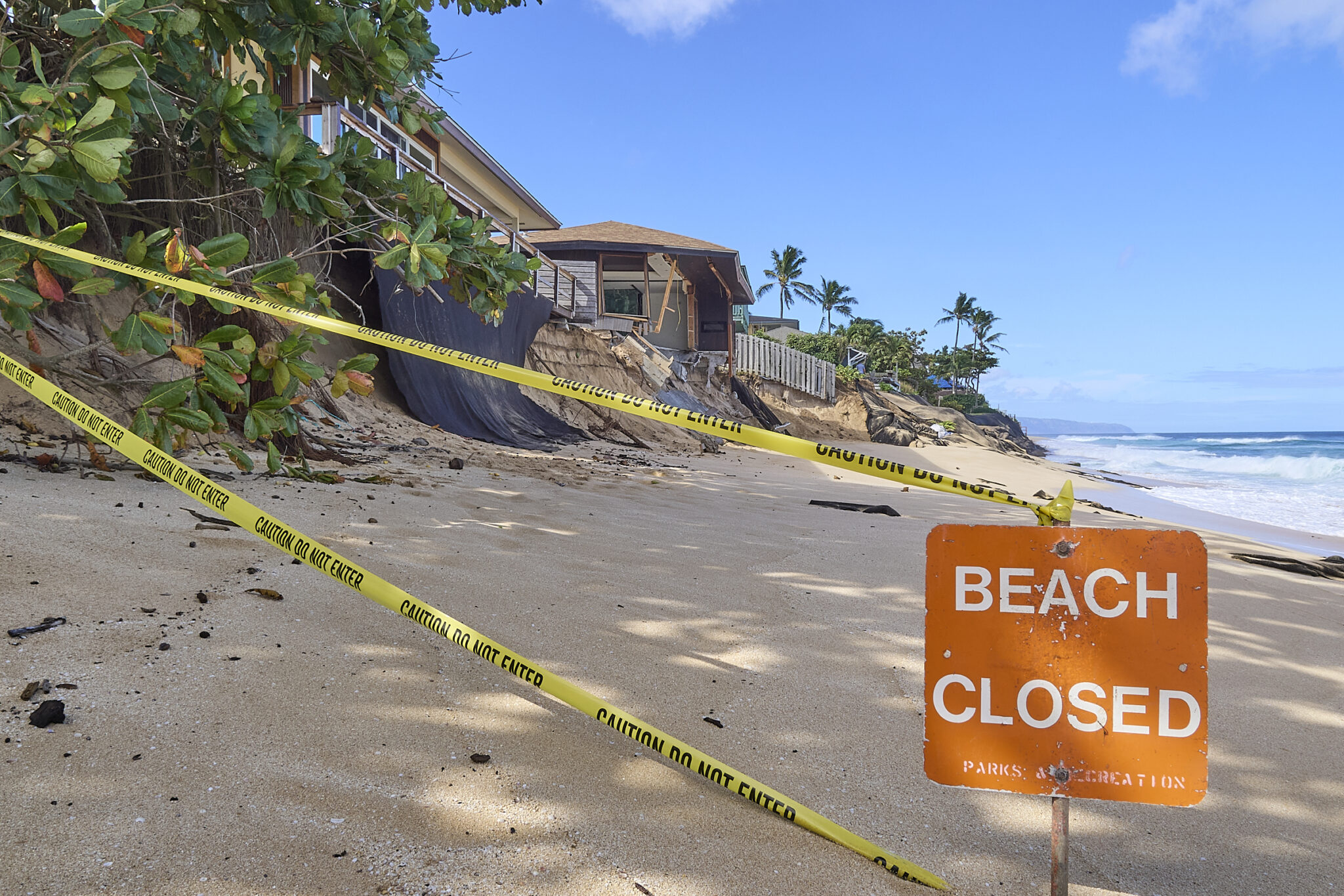 It’s just the beginning of the 2024-2025 big surf season that is expected to bring waves with surf heights as large as 40 ft faces. These homes in the vicinity of 59-147 and 59-149 Ke Nui Road just south of Sunset Beach on Oahu’s famed North Shore are already beginning to show signs of collapse and will probably not survive. (David Croxford/Civil Beat/2024)