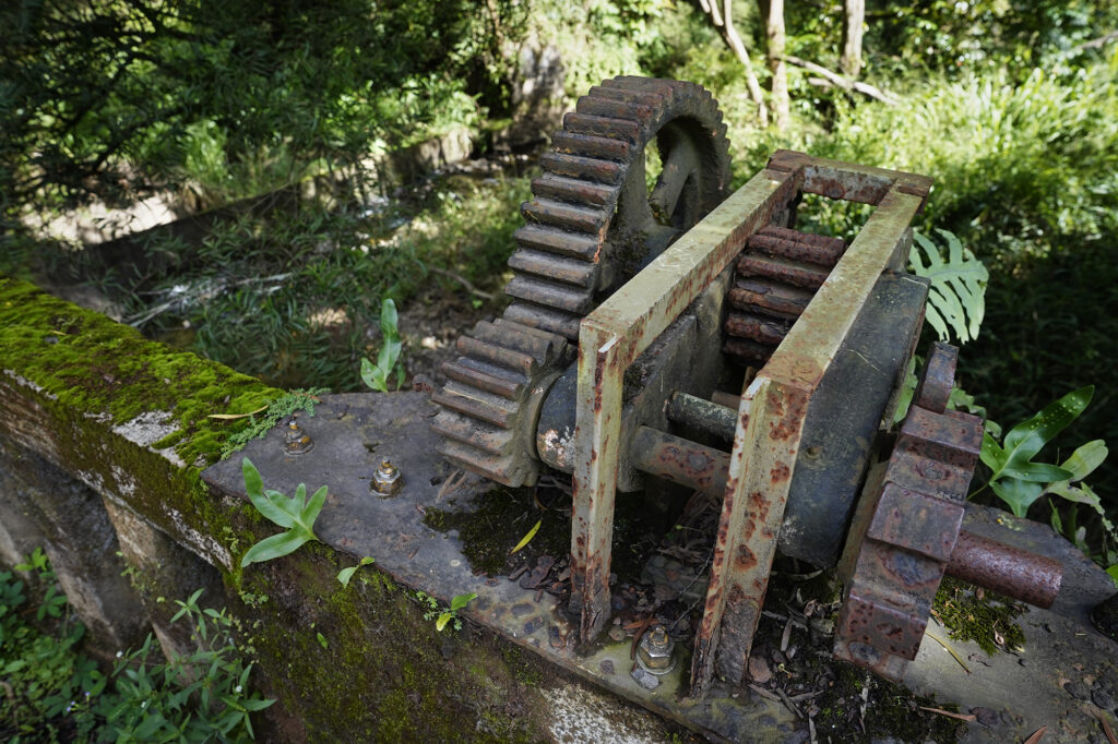 The mechanism to lower and raise a gate to divert water on Hoolawa Stream is photographed in its non-function state Thursday, Oct. 3, 2024, in Huelo. East Maui water rights are a point of contention. (Kevin Fujii/Civil Beat/2024)
