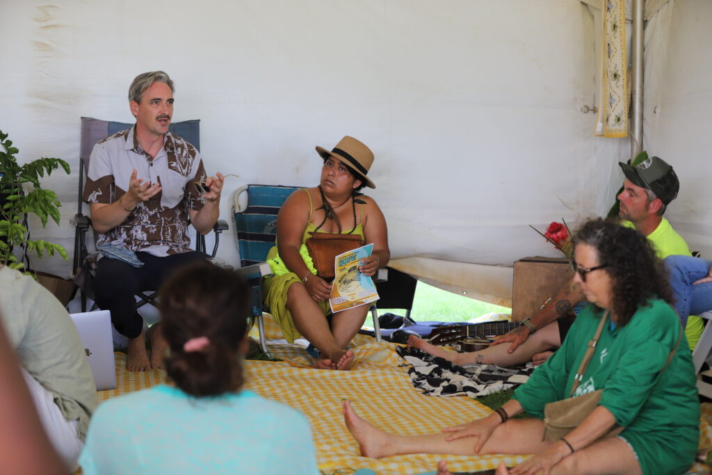 HFU Advocacy Director Hunter Heaivilin, left, and Kau Chapter President Andrea Drayer discuss policy with members. Heaivilin spent the past year visiting the organization’s 16 chapters to canvass members’ priorities.