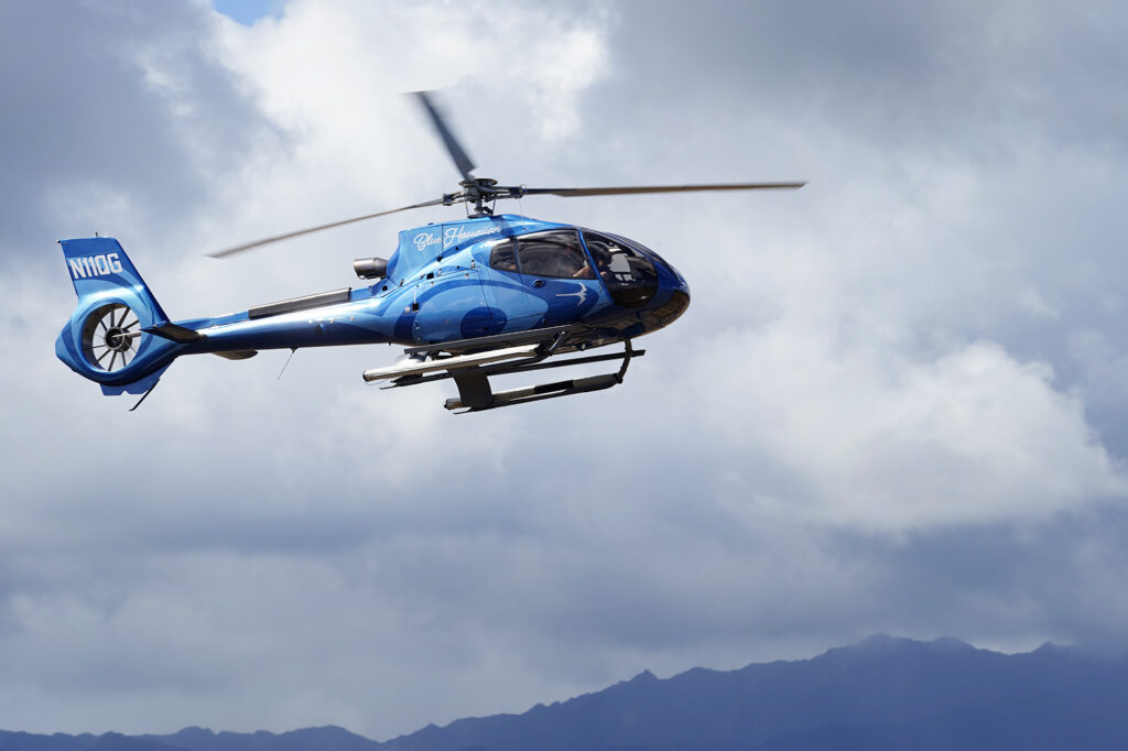 A Blue-Hawaiian tour helicopter prepares to land Wednesday, Oct. 9, 2024, in Lihue. (Kevin Fujii/Civil Beat/2024)